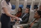 The flight attendant kept looking at the quiet woman